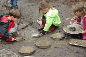 kids making mud pies