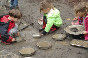 kids making mud pies